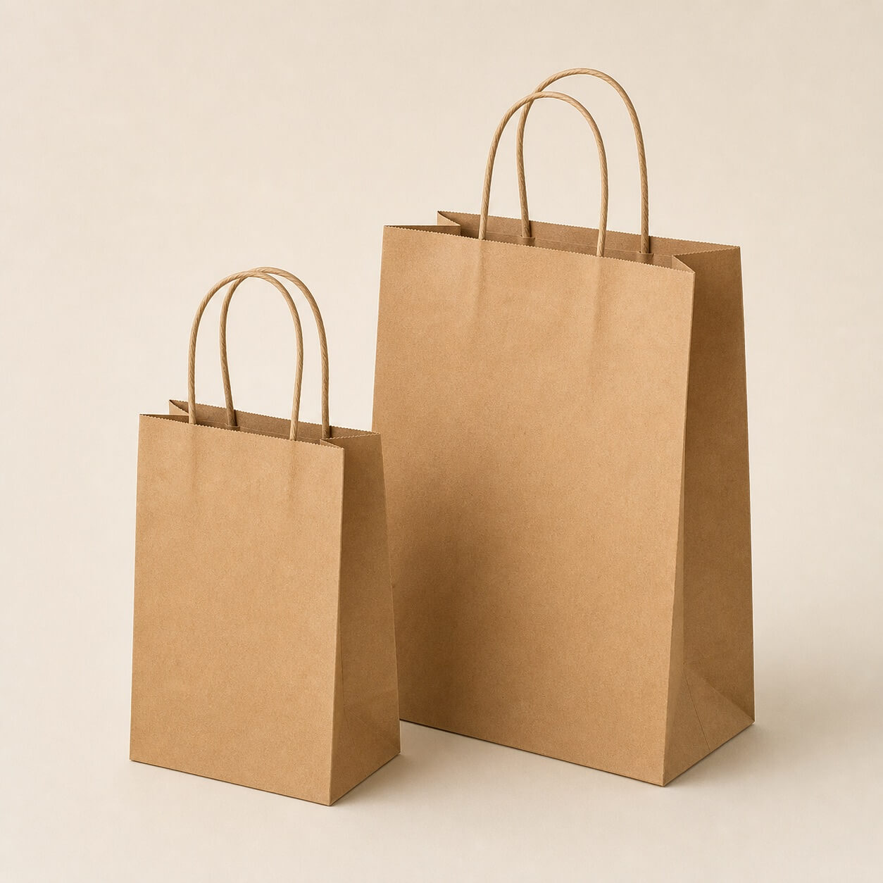 Plain kraft paper carry bags with twisted handles in two sizes